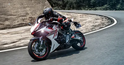The Zontes 703RR leaned into a corner on a mountain road, official manufacturer photo